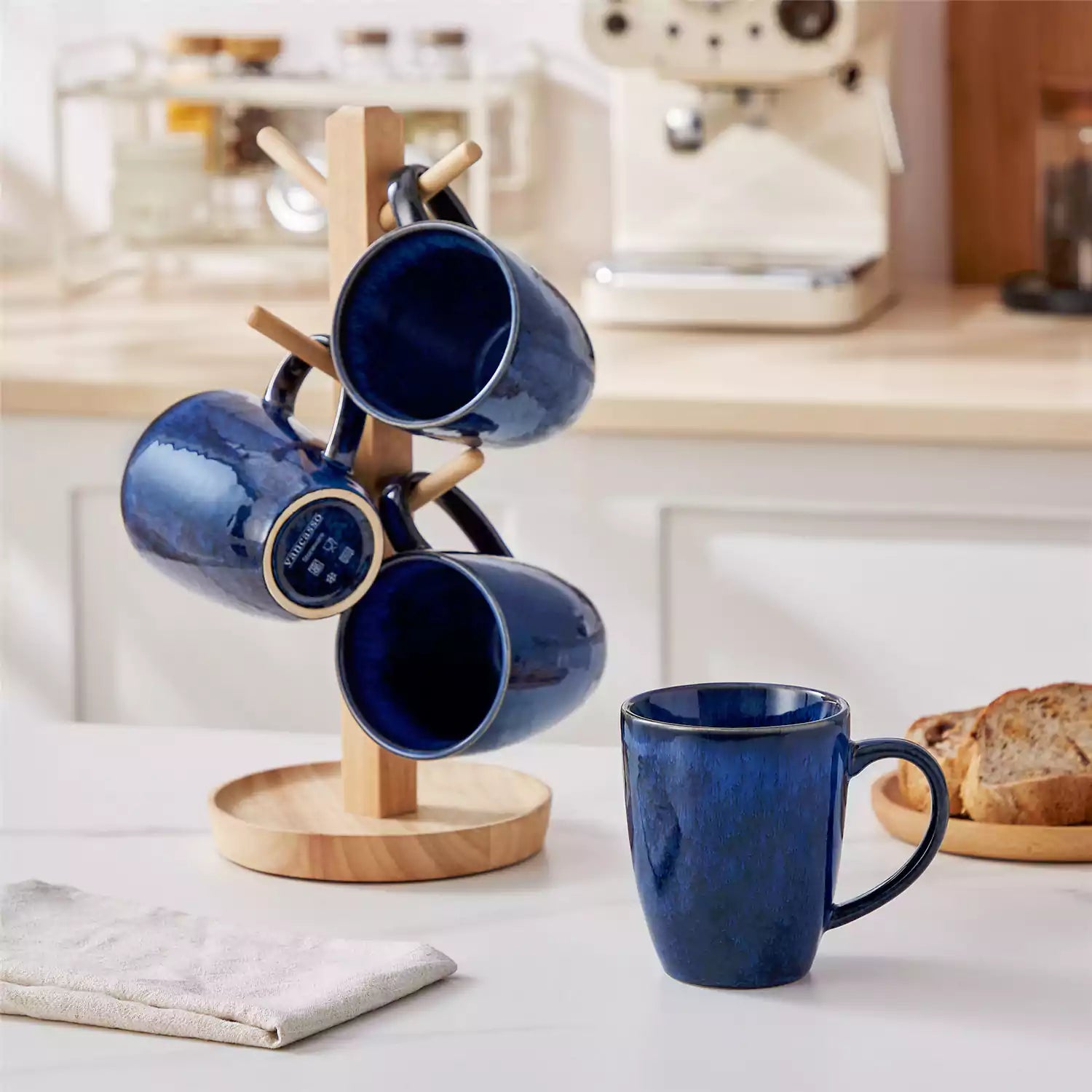 Blue Starry 12oz stoneware mugs set of 4 with reactive glaze finish on a kitchen counter with coffee milk and fresh bread