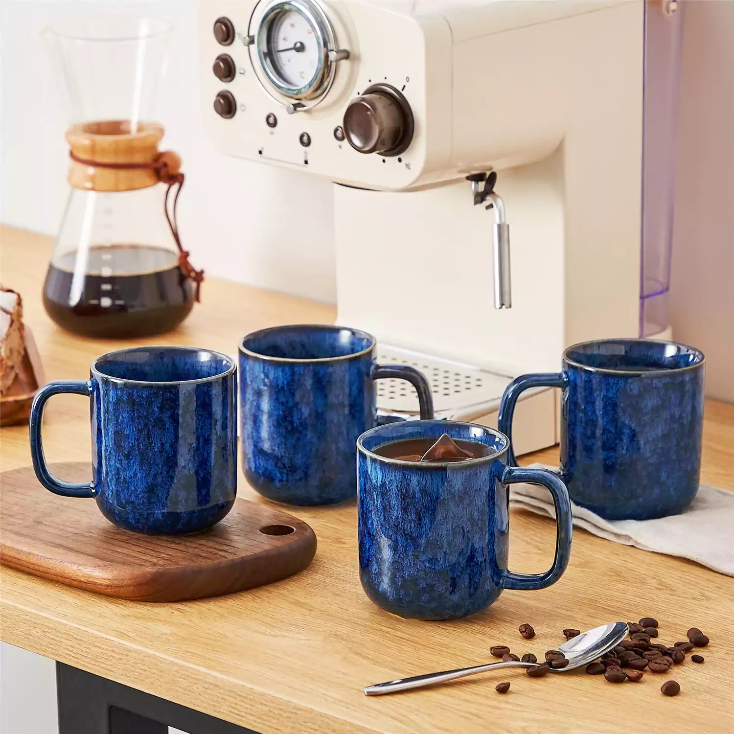Starry blue 12oz stoneware mugs set of 4 with coffee on wooden table next to coffee maker and fresh bread cozy breakfast scene