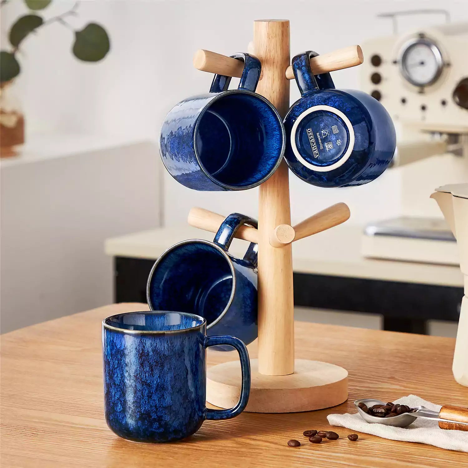 Starry blue 12oz stoneware mugs set of 4 with coffee on wooden table next to coffee maker and fresh bread cozy breakfast scene