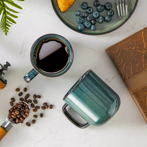 Starry gently curved green mugs set of 6 displayed on a wooden table with a coffee maker and a plate of pastries