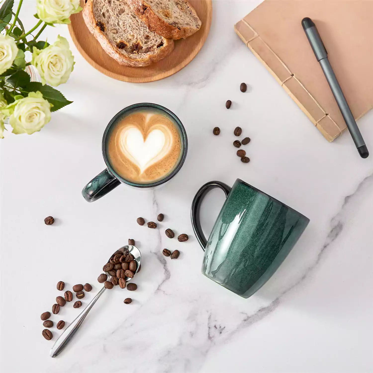 Green Starry 12oz stoneware mugs set of 4 with reactive glaze finish on a kitchen counter with coffee milk and fresh bread