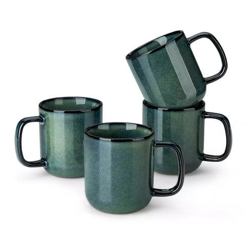 Starry teal 12oz stoneware mugs set of 4 with coffee on wooden table next to coffee maker and fresh bread cozy breakfast scene