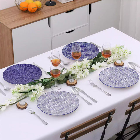 Porcelain dinner plates set of 4 with classic Japanese indigo stripe patterns, featuring assorted designs, ideal for serving steak.